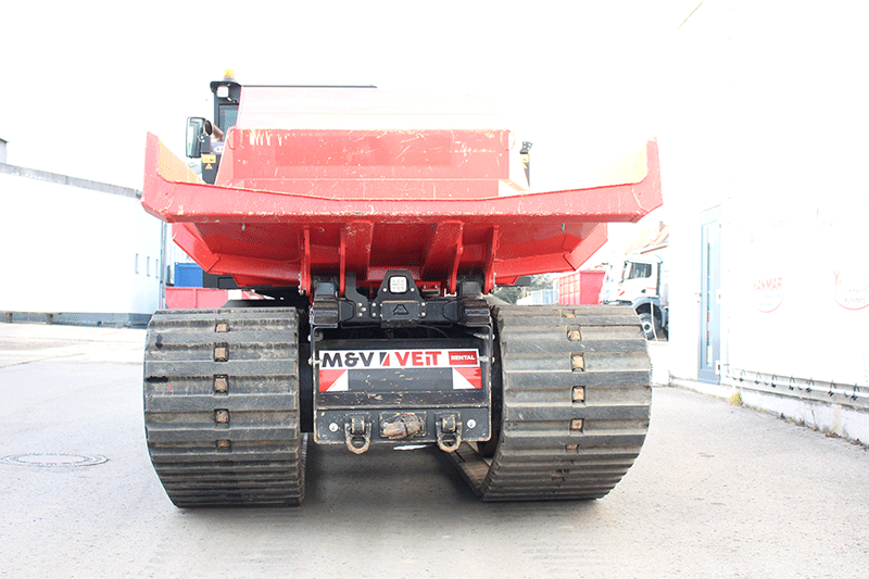 Heckansicht des PowerBully 12 D Kettendumpers – robuste Konstruktion und Muldenbereich für den professionellen Einsatz auf Baustellen